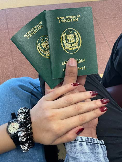Pakistani passport with Canada visa application documents